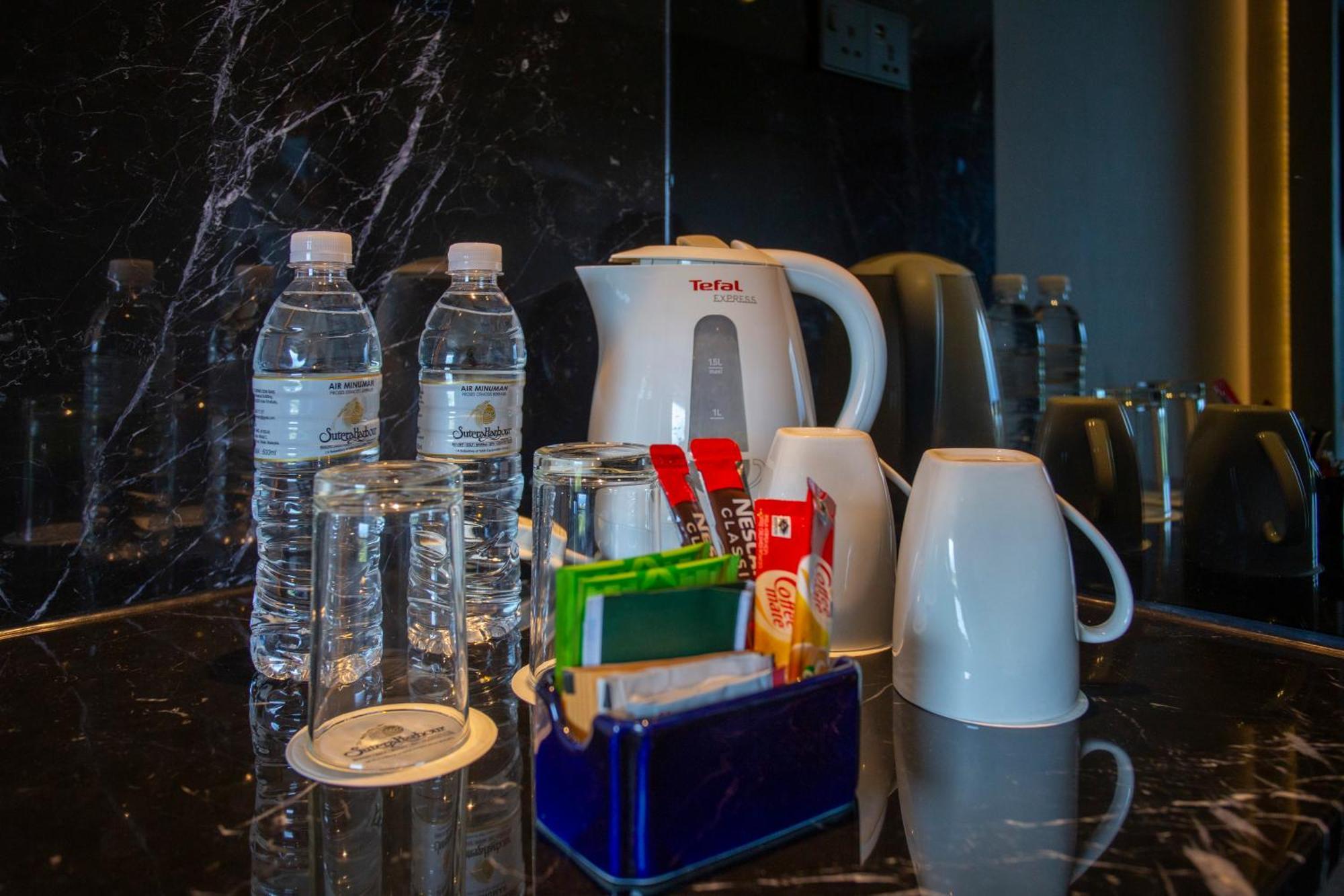 The Pacific Sutera Hotel Kota Kinabalu Exterior foto Bottled water in a hotel room